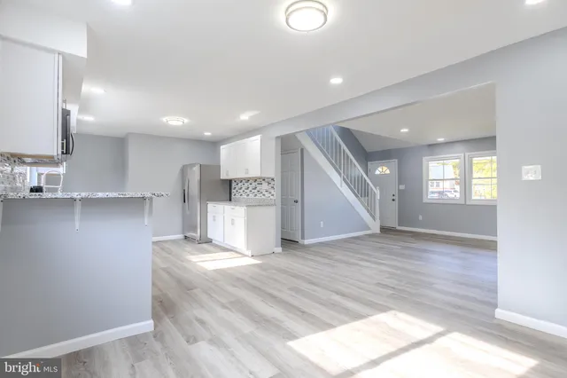a view of a kitchen with a sink and a window