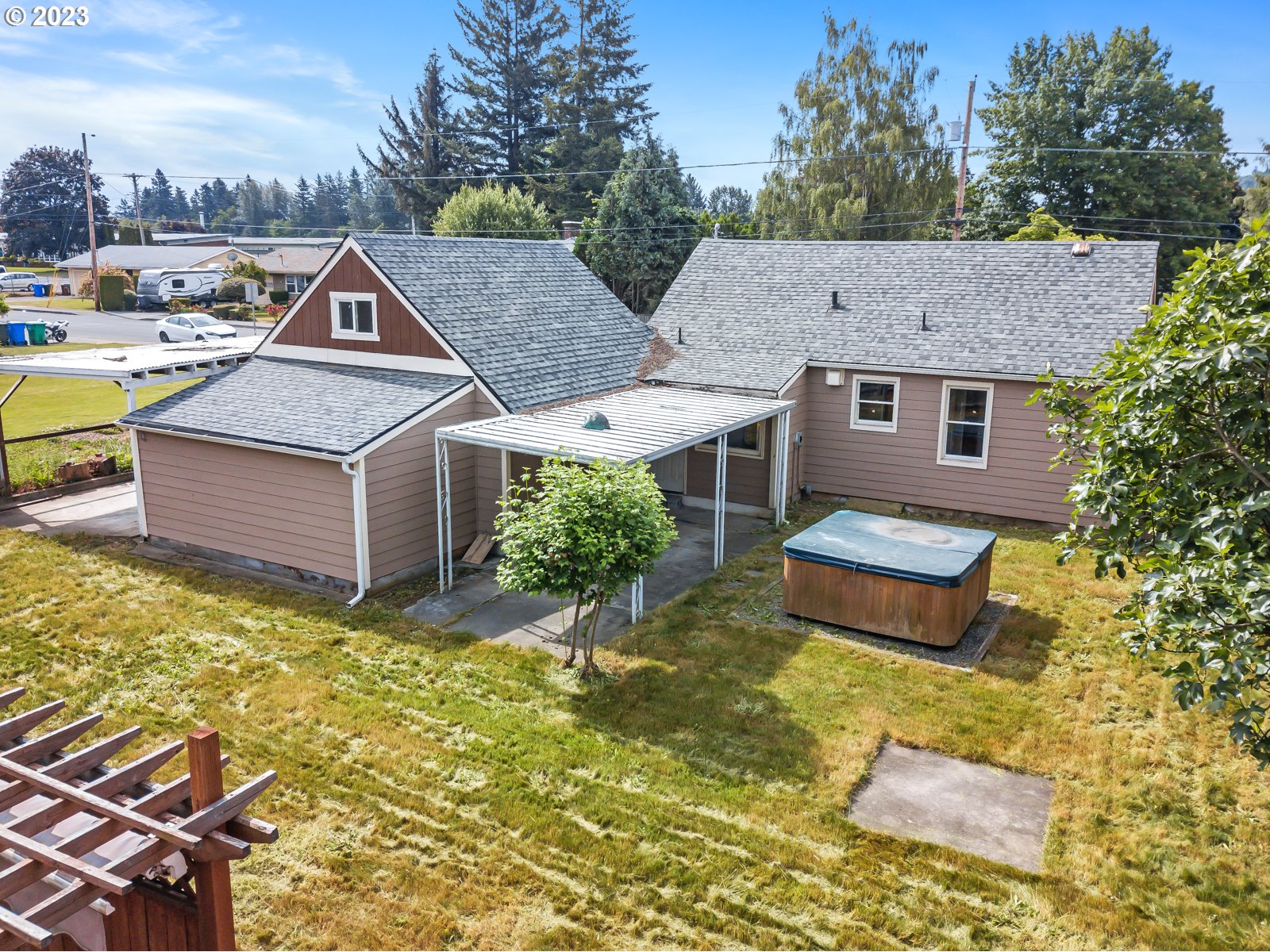 711 Southeast 5th Street Gresham, OR 97080 - Photo 4 of 8 a aerial view of a house with swimming pool and sitting area