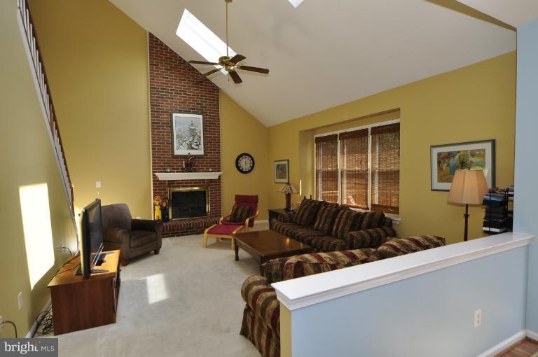 1338 Dasher Lane Reston, VA 20190 - Photo 11 of 24 a living room with furniture fireplace and flat screen tv