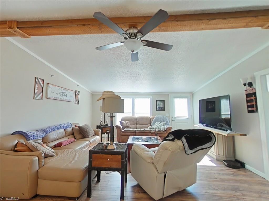 4766 Kennedy Road Trinity, NC 27370 - Photo 8 of 32 Living room at front entry of this updated home with laminate wood floors