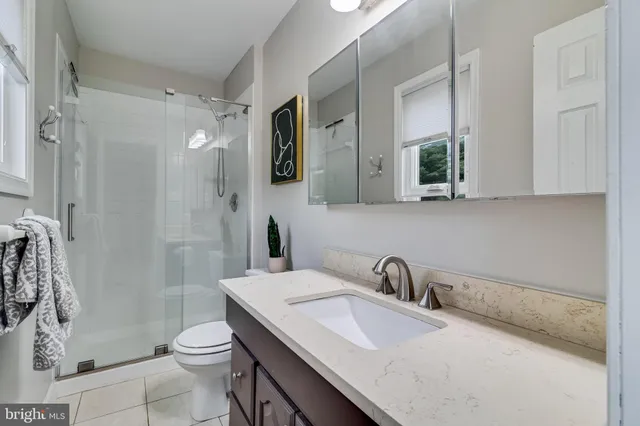 a bathroom with a sink a toilet and a bathtub