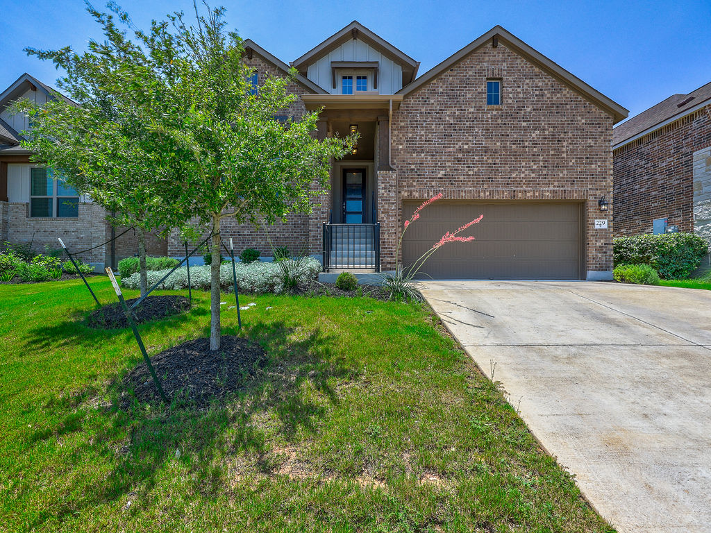 229 Heartleaf Road San Marcos, TX 78666 - Photo 1 of 40 A classic brick exterior with a welcoming entryway and an attached garage awaits.