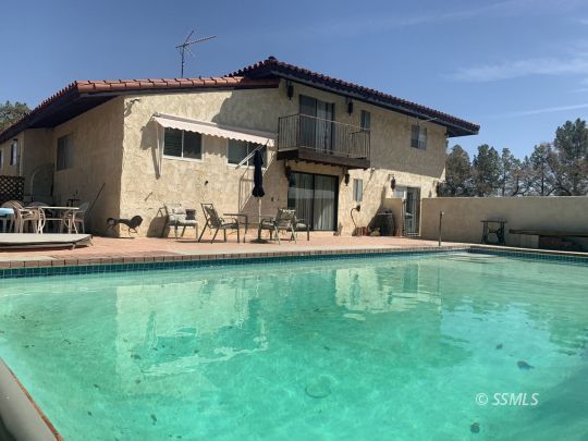 1221 North Garth Street Ridgecrest, CA 93555 - Photo 24 of 29 a front view of a house with garden