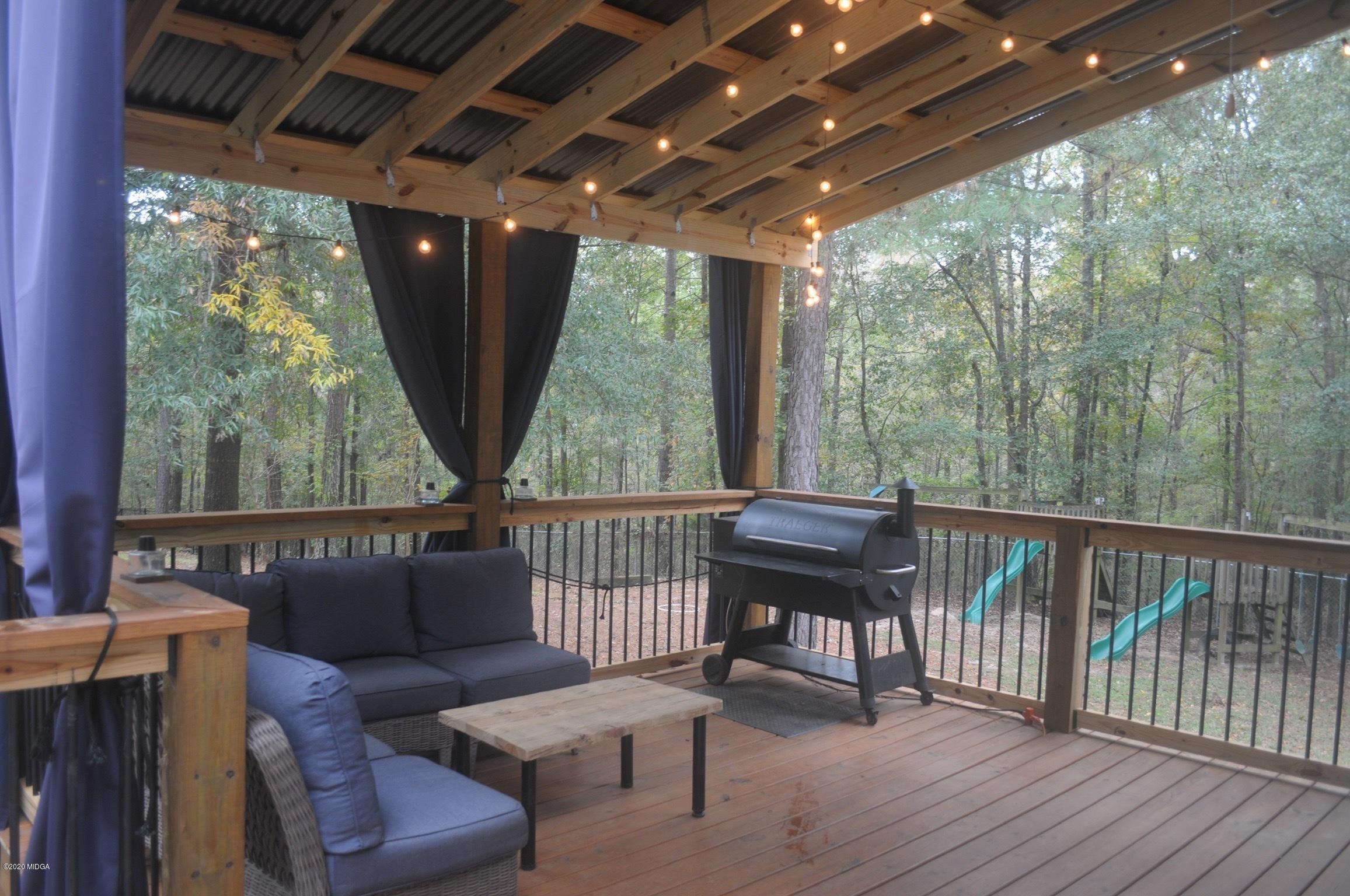 17 Old Benton Road Juliette, GA 31046 - Photo 16 of 19 a balcony with furniture and a swing