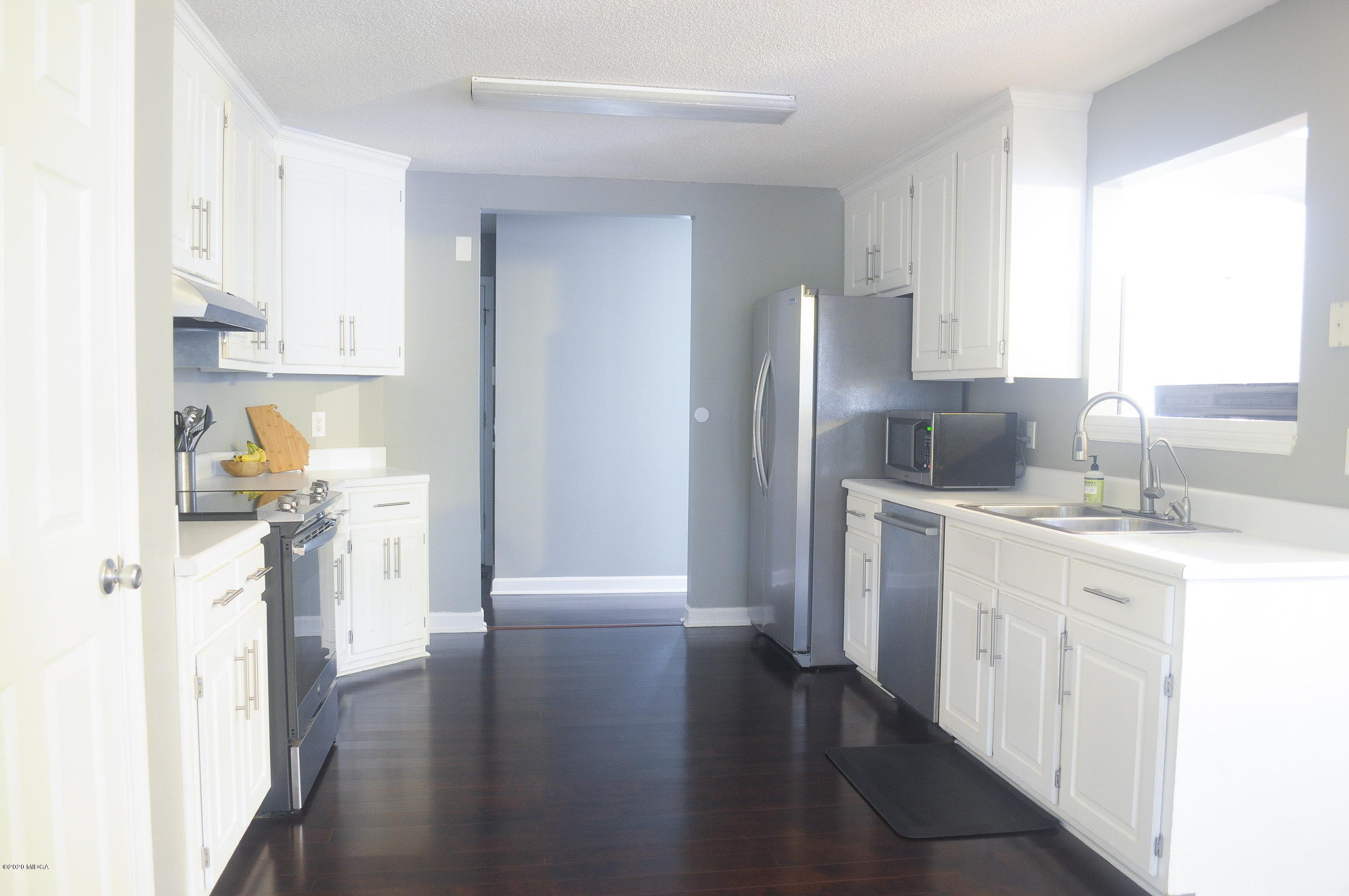 17 Old Benton Road Juliette, GA 31046 - Photo 3 of 19 a kitchen with a refrigerator sink and cabinets