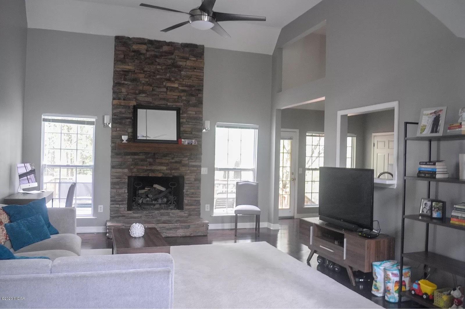 17 Old Benton Road Juliette, GA 31046 - Photo 6 of 19 a living room with furniture and a flat screen tv
