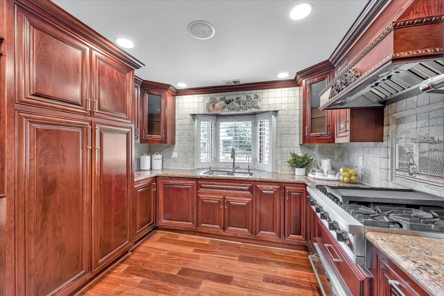 1623 Fallen Leaf Lane Los Altos, CA 94024 - Photo 17 of 62 a kitchen with stainless steel appliances granite countertop a sink stove and refrigerator