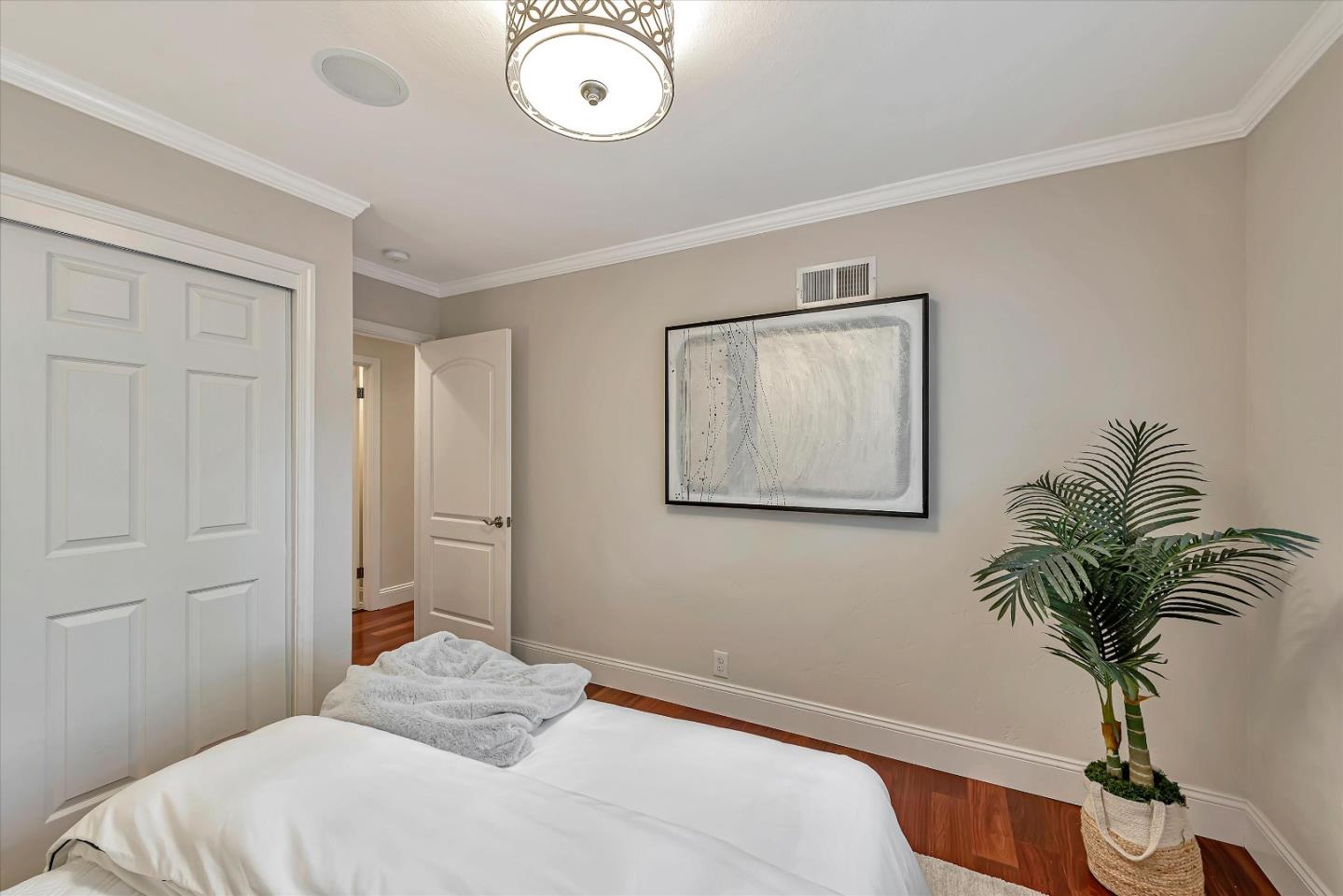 1623 Fallen Leaf Lane Los Altos, CA 94024 - Photo 39 of 62 a bedroom with a bed and a potted plant