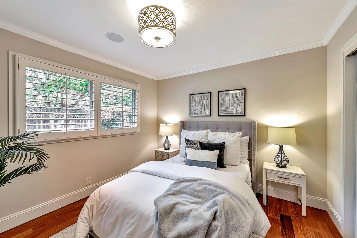 1623 Fallen Leaf Lane Los Altos, CA 94024 - Photo 41 of 62 a bedroom with a bed and a table in it with window