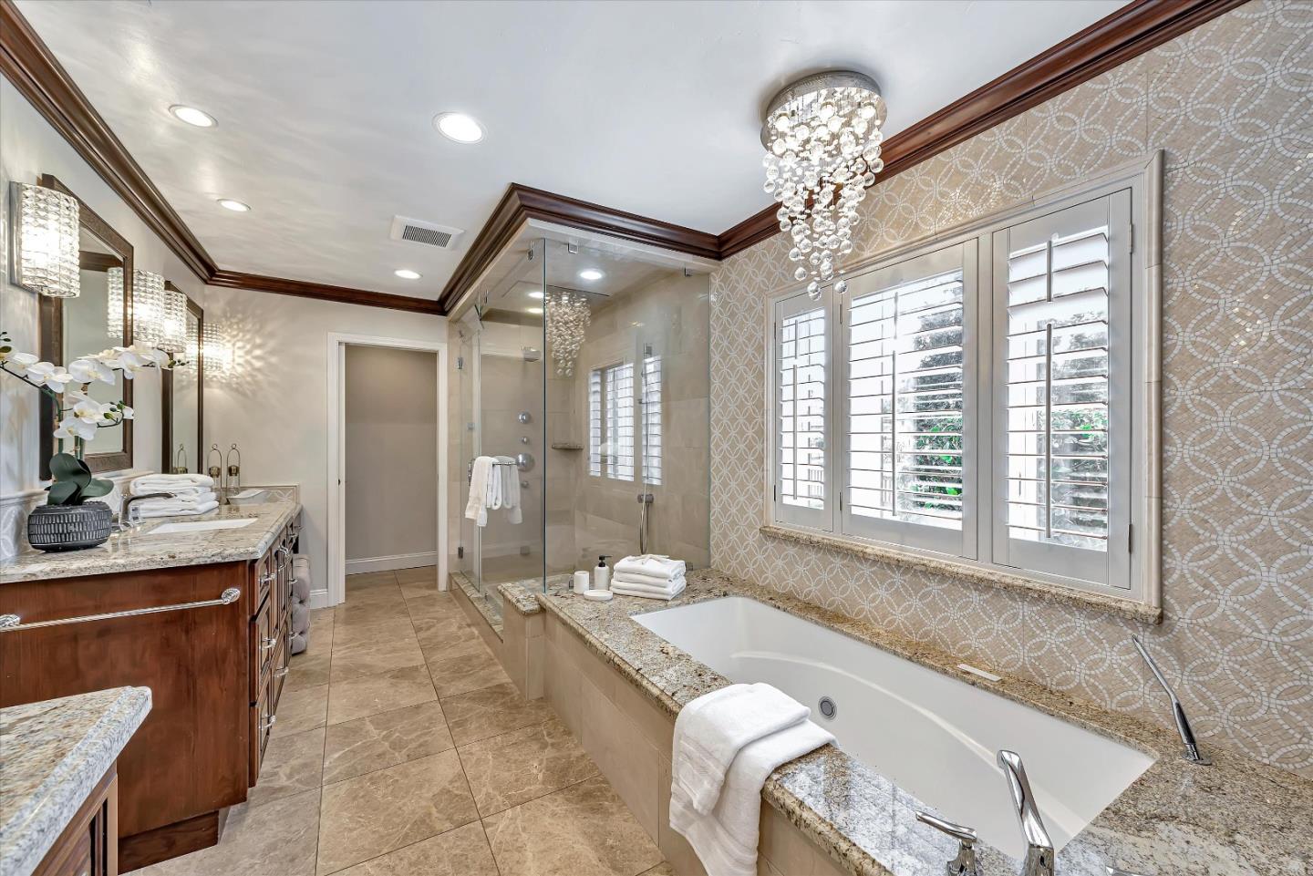 1623 Fallen Leaf Lane Los Altos, CA 94024 - Photo 45 of 62 a spacious bathroom with a granite countertop sink a toilet a mirror and a tub