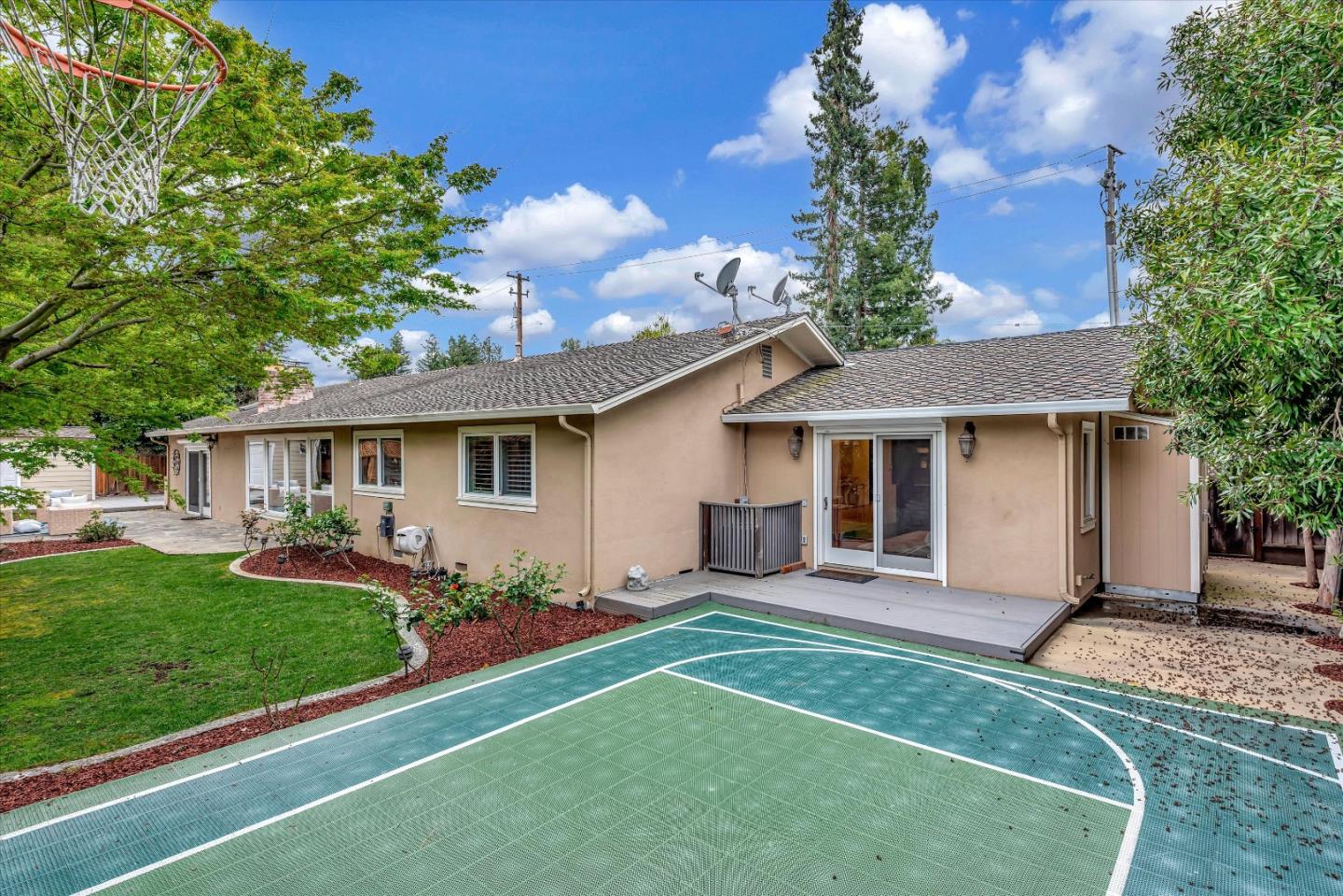 1623 Fallen Leaf Lane Los Altos, CA 94024 - Photo 56 of 62 a front view of a house with a garden and trees