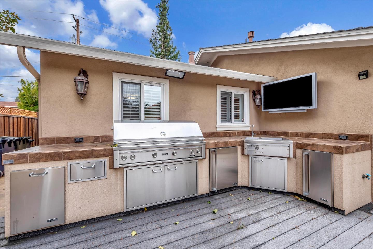 1623 Fallen Leaf Lane Los Altos, CA 94024 - Photo 60 of 62 a kitchen with stainless steel appliances granite countertop a stove a sink and a microwave