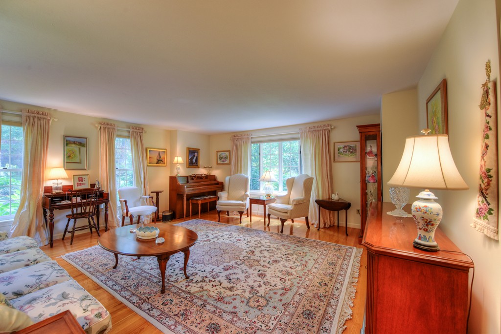 65 Tupelo Road Barnstable, MA 02635 - Photo 12 of 27 a living room with furniture a table and large window