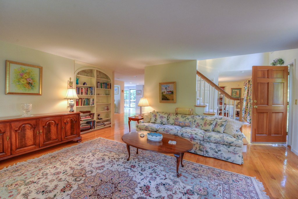 65 Tupelo Road Barnstable, MA 02635 - Photo 13 of 27 a living room with furniture and a rug
