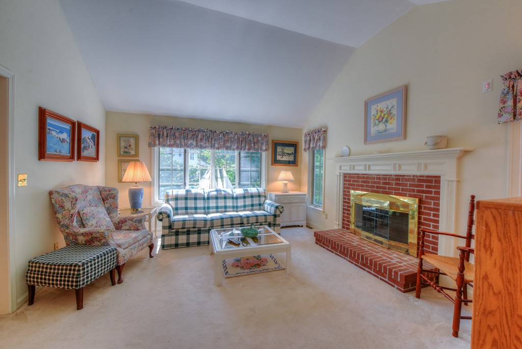 65 Tupelo Road Barnstable, MA 02635 - Photo 15 of 27 a living room with furniture and a fireplace