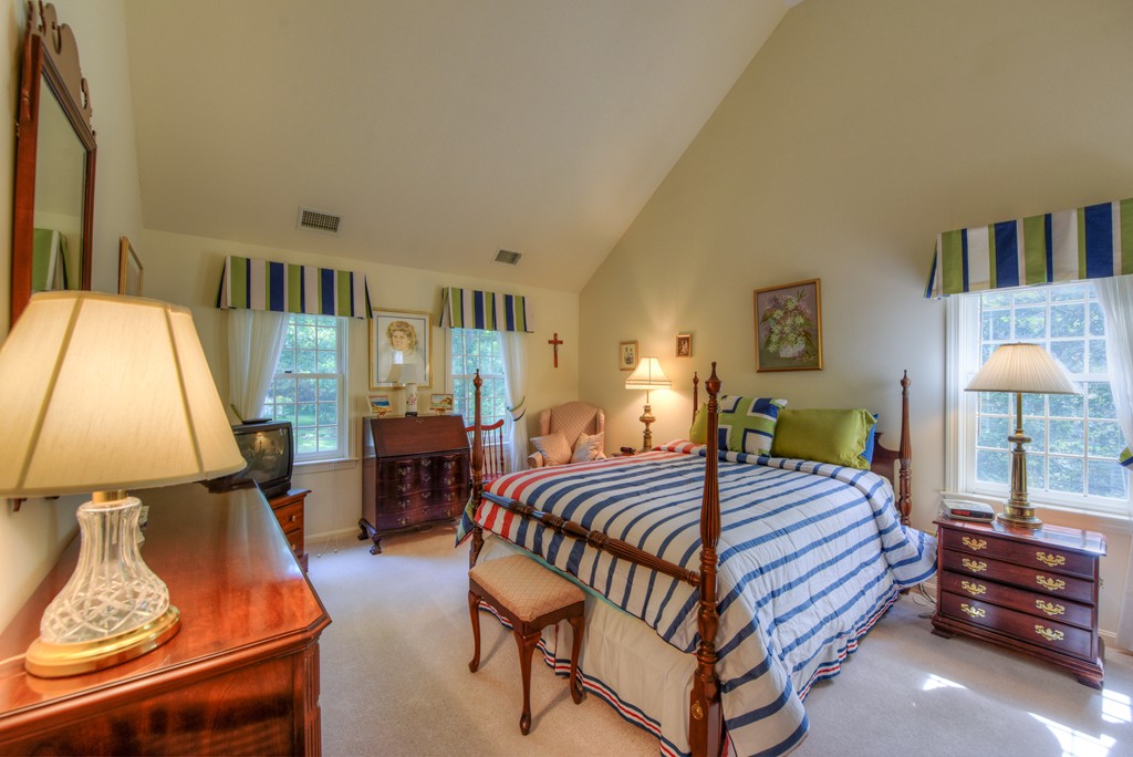 65 Tupelo Road Barnstable, MA 02635 - Photo 18 of 27 a bedroom with a bed and wooden floor