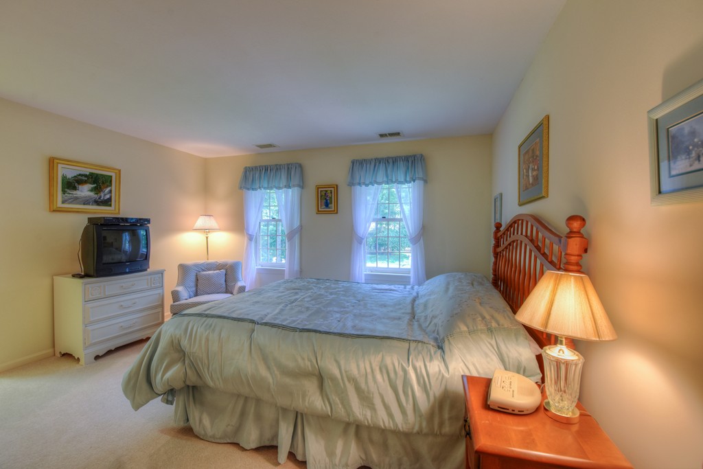 65 Tupelo Road Barnstable, MA 02635 - Photo 23 of 27 a bedroom with a bed and window