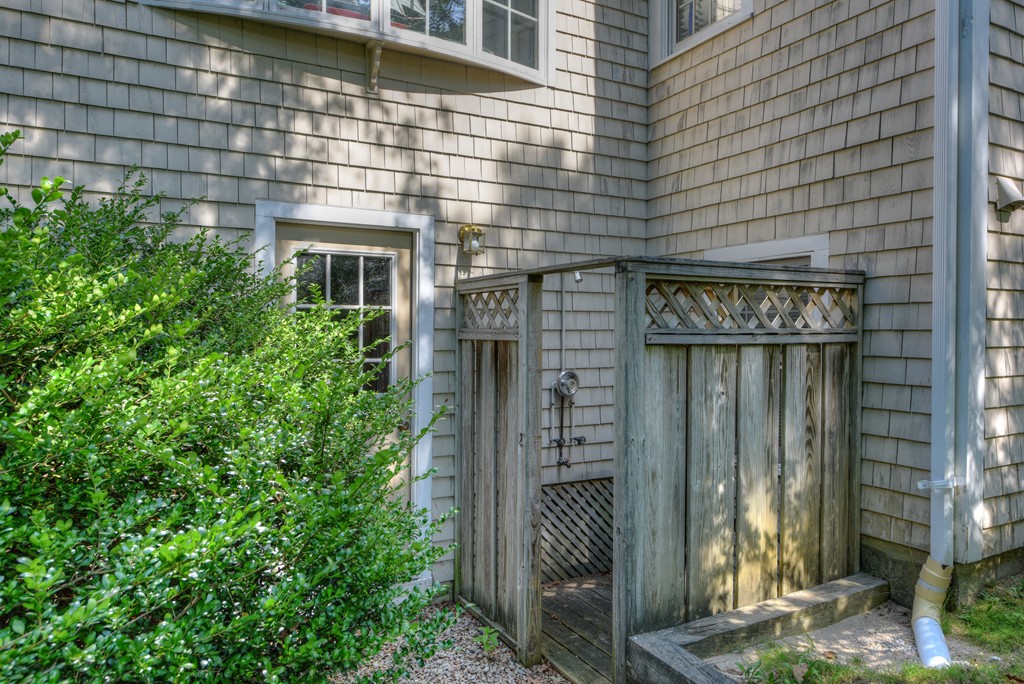 65 Tupelo Road Barnstable, MA 02635 - Photo 26 of 27 a front view of a building with garden