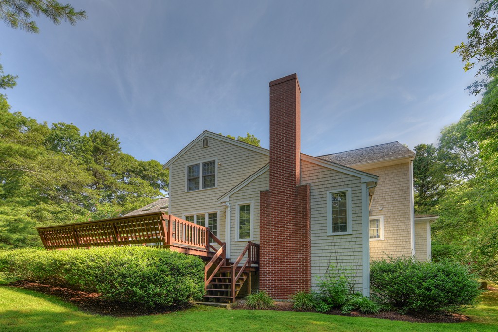65 Tupelo Road Barnstable, MA 02635 - Photo 5 of 27 a front view of a house with garden