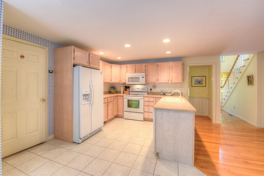 65 Tupelo Road Barnstable, MA 02635 - Photo 7 of 27 a kitchen with cabinets and stainless steel appliances