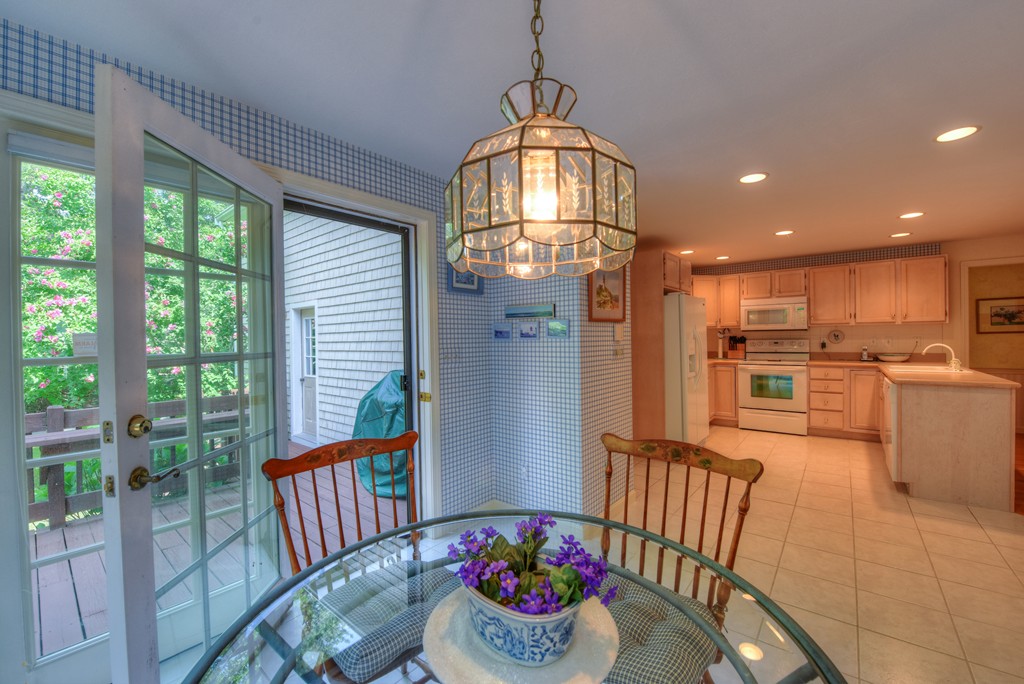 65 Tupelo Road Barnstable, MA 02635 - Photo 8 of 27 a view of a dining room with furniture window and wooden floor