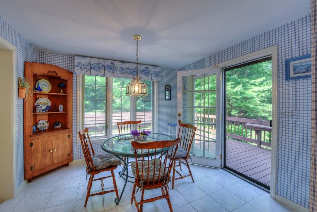 65 Tupelo Road Barnstable, MA 02635 - Photo 9 of 27 a view of a dining room with furniture window and outside view