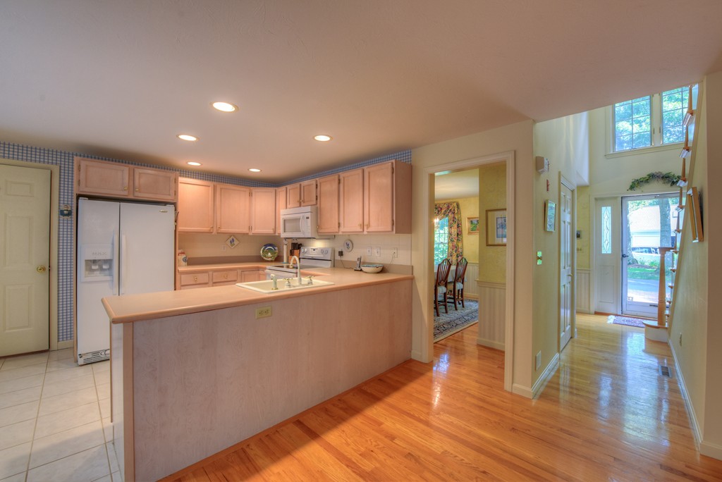 65 Tupelo Road Barnstable, MA 02635 - Photo 10 of 27 a kitchen with stainless steel appliances granite countertop a refrigerator and a sink