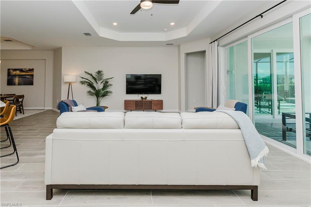15862 Sugar Hl Drive Babcock Ranch, FL 33982 - Photo 12 of 50 a living room with furniture and a flat screen tv