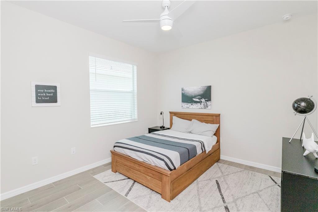 15862 Sugar Hl Drive Babcock Ranch, FL 33982 - Photo 21 of 50 a bedroom with a bed and a window
