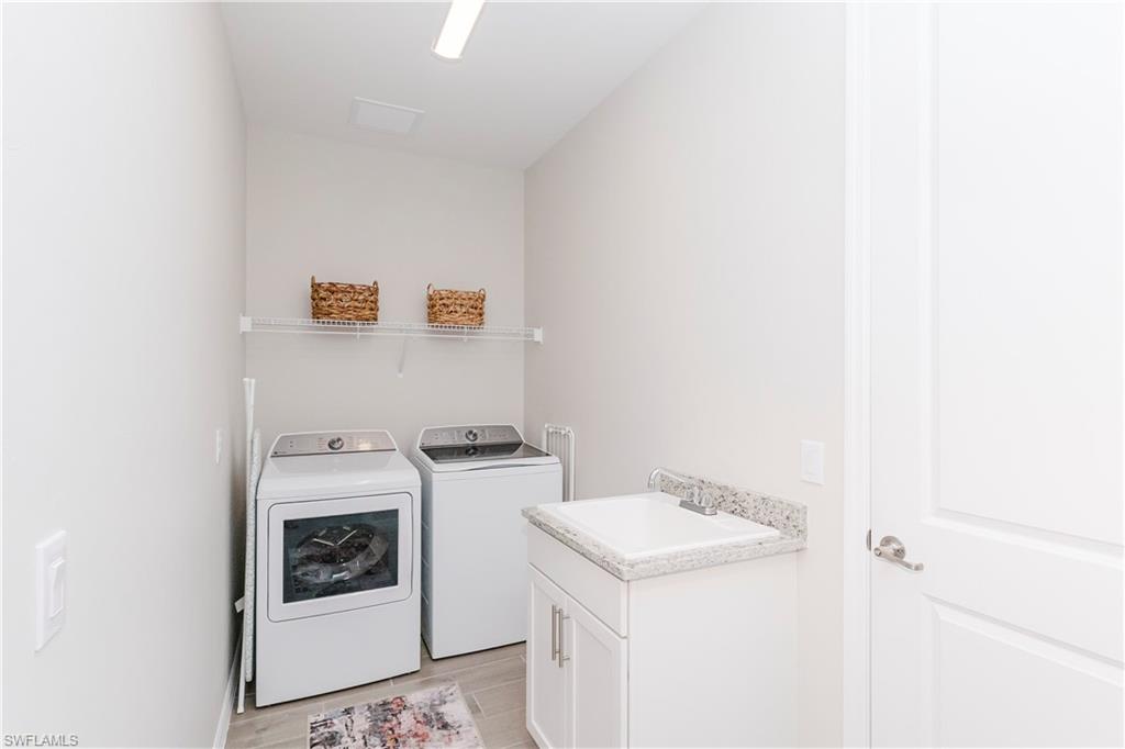 15862 Sugar Hl Drive Babcock Ranch, FL 33982 - Photo 25 of 50 a utility room with dryer and washer