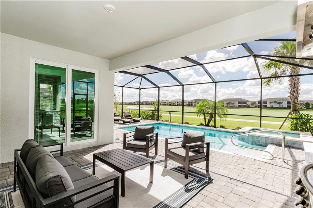 15862 Sugar Hl Drive Babcock Ranch, FL 33982 - Photo 26 of 50 a living room with furniture and floor to ceiling windows