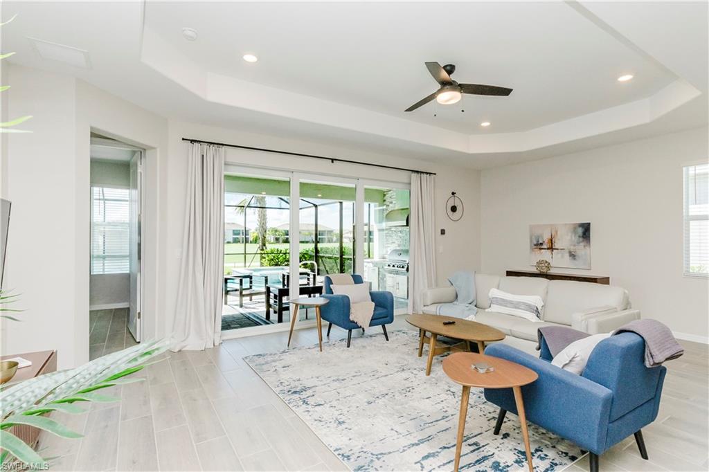 15862 Sugar Hl Drive Babcock Ranch, FL 33982 - Photo 8 of 50 a living room with furniture and a large window