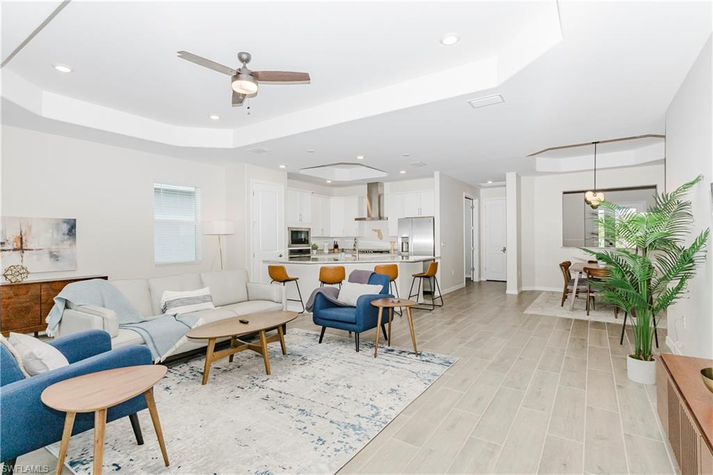 15862 Sugar Hl Drive Babcock Ranch, FL 33982 - Photo 9 of 50 a living room with furniture and a table
