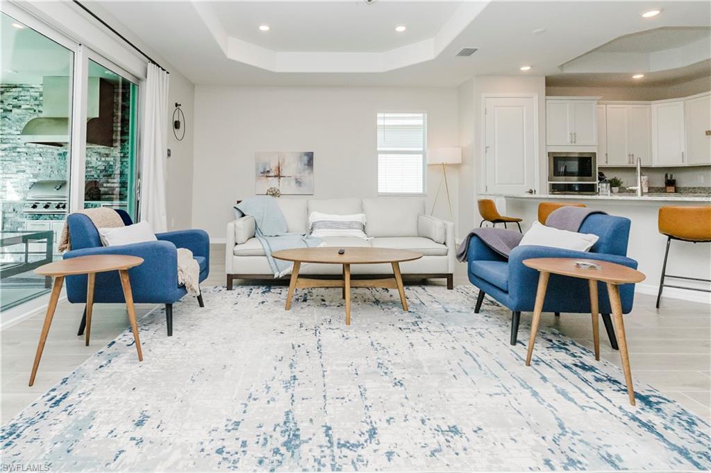 15862 Sugar Hl Drive Babcock Ranch, FL 33982 - Photo 10 of 50 a living room with furniture and a wooden floor