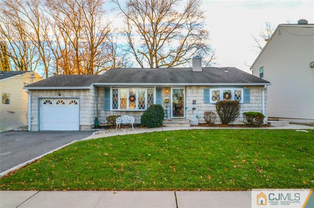 11 Westminster Road Colonia, NJ 07067 - Photo 1 of 24 a front view of a house with a yard and trees