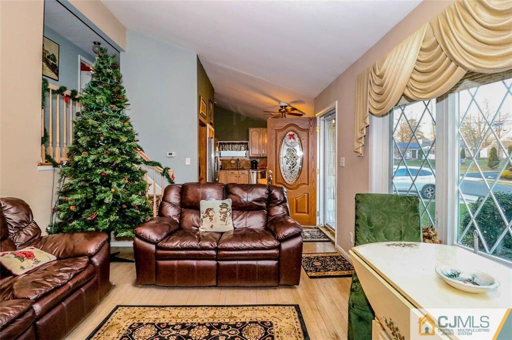 11 Westminster Road Colonia, NJ 07067 - Photo 14 of 24 a living room with furniture and a potted plant