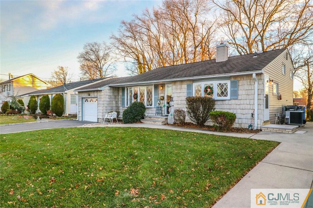 11 Westminster Road Colonia, NJ 07067 - Photo 4 of 24 a front view of house with yard patio and green space