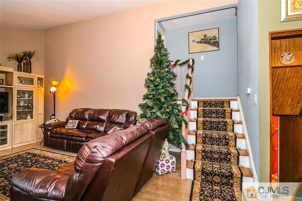 11 Westminster Road Colonia, NJ 07067 - Photo 5 of 24 a living room with furniture and a potted plant