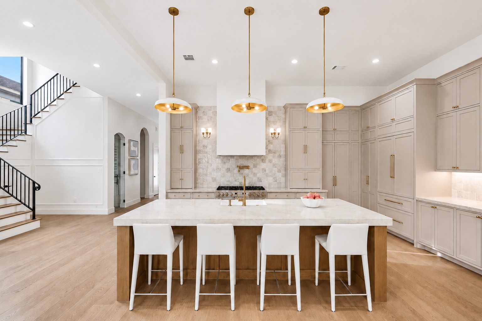 2325 Wroxton Road Houston, TX 77005 - Photo 4 of 34 Oversized stained island with room for pantry of seating, pendants, expansive run of countertop and under cabinet lighting