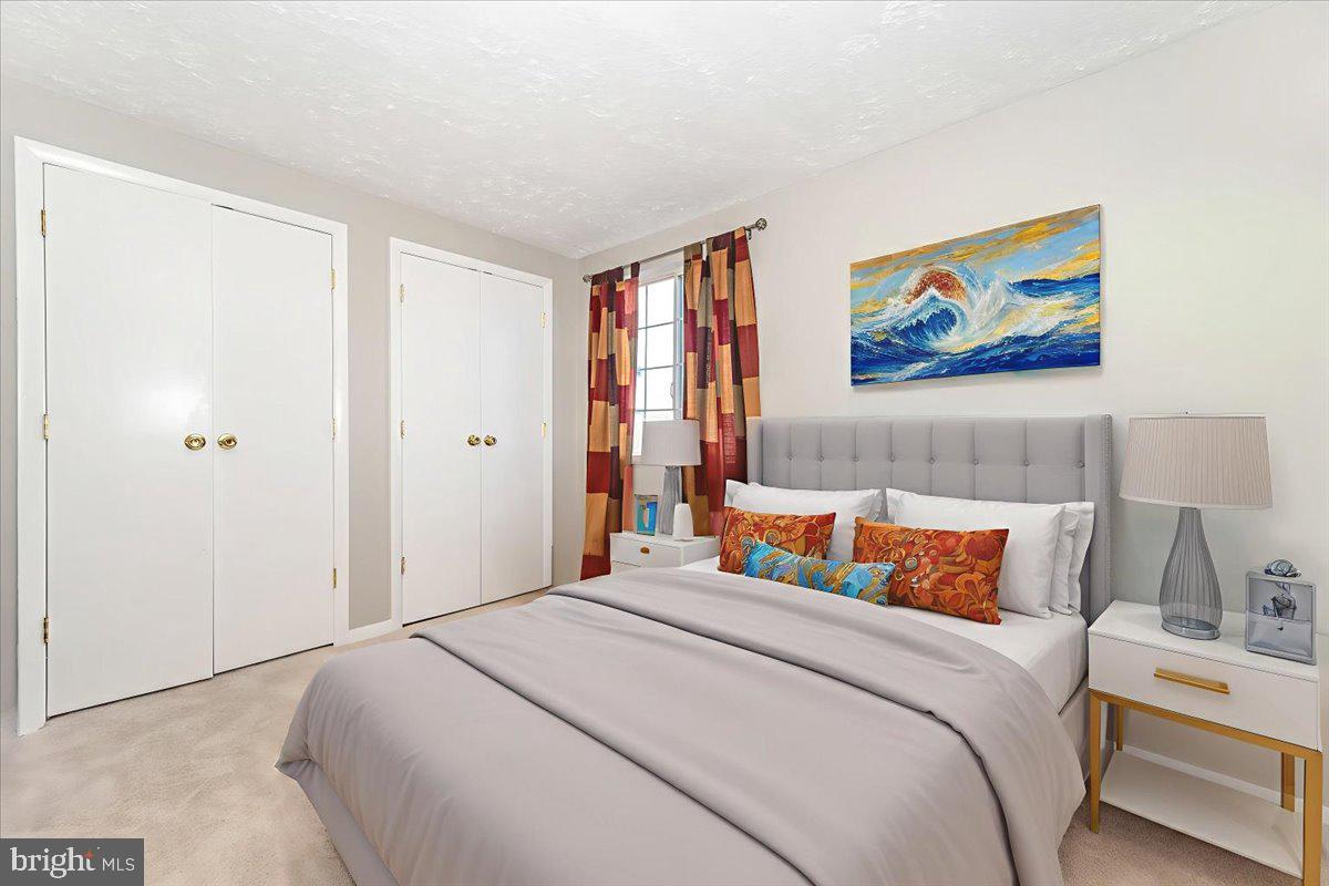 6813 Farmbrook Court Frederick, MD 21703 - Photo 26 of 40 a bedroom with bed and wall painting