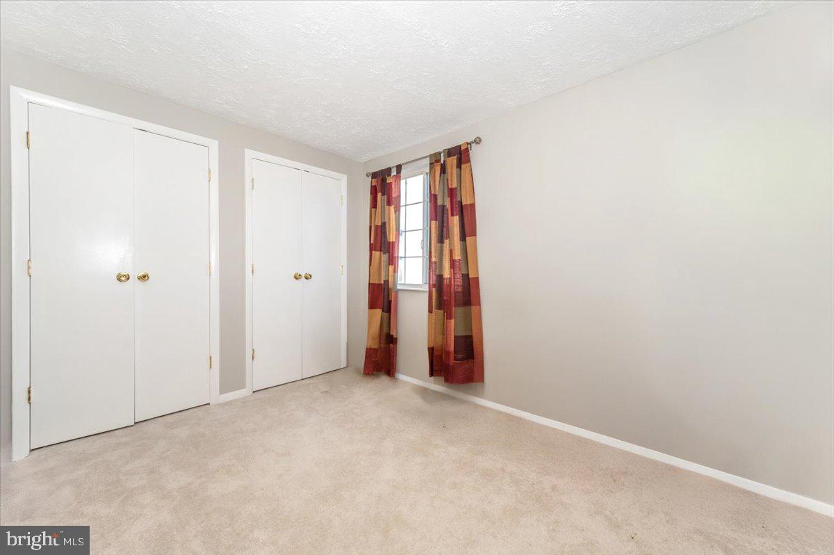 6813 Farmbrook Court Frederick, MD 21703 - Photo 27 of 40 a view of an empty room with a window