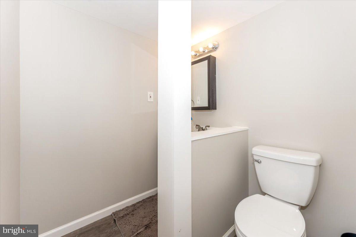 6813 Farmbrook Court Frederick, MD 21703 - Photo 31 of 40 a white toilet sitting next to a white sink