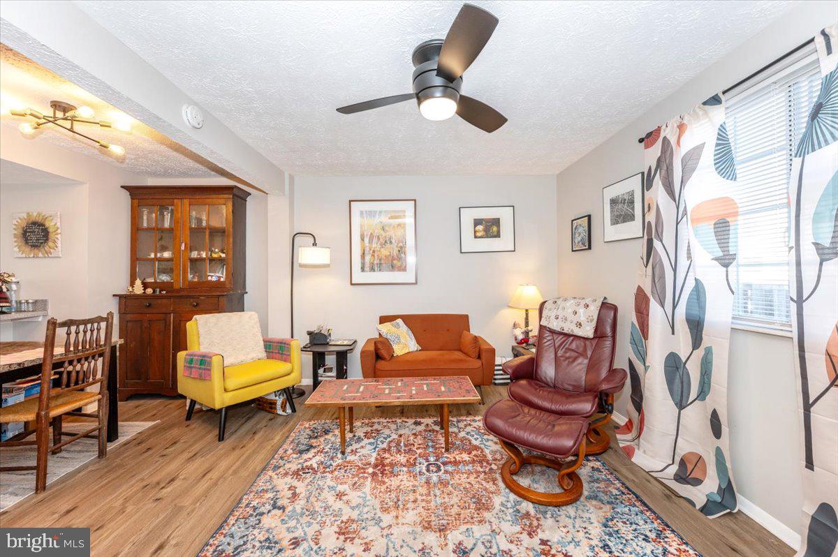 6813 Farmbrook Court Frederick, MD 21703 - Photo 10 of 40 a living room with furniture and a rug