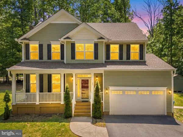 a front view of a house with yard