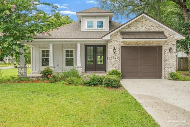 front view of a house with a yard