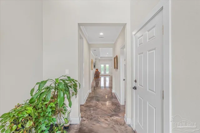 a view of a hallway with flowers in it
