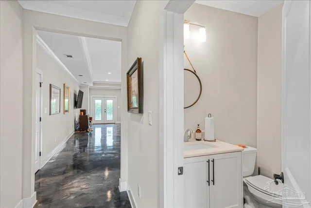 a bathroom with a sink vanity and a mirror