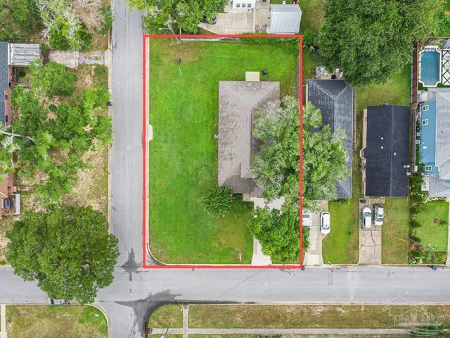 an aerial view of a house with a garden