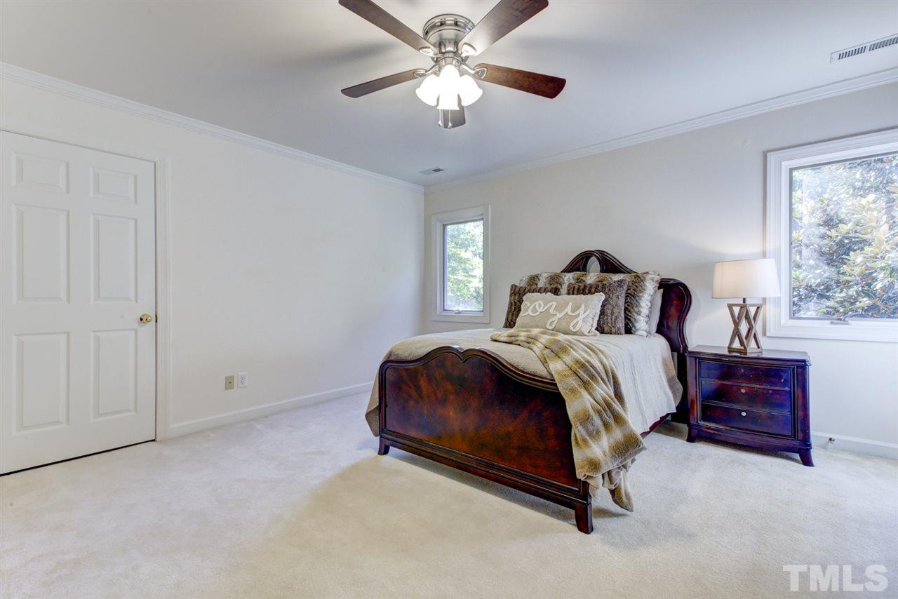 19 Covington Lane Durham, NC 27712 - Photo 19 of 30 a bedroom with a bed and window