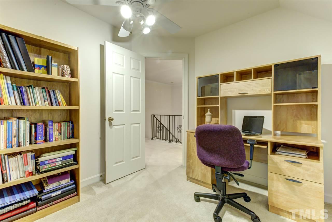 19 Covington Lane Durham, NC 27712 - Photo 20 of 30 a workspace with furniture bookshelf and a window